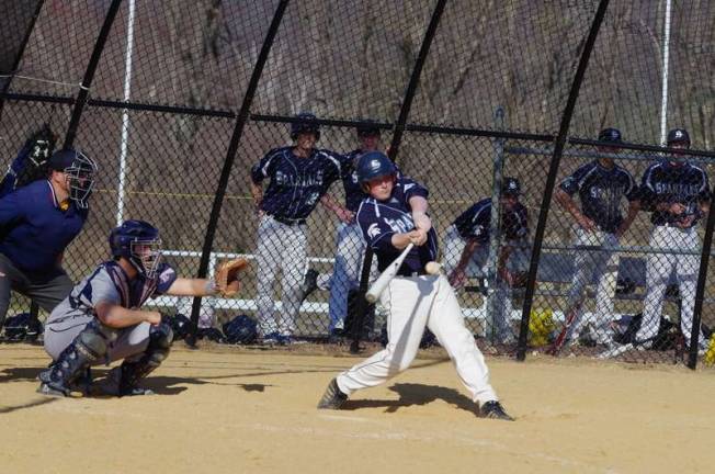 Sparta's Michael Meisel swings hard during an at-bat against Jefferson High School.