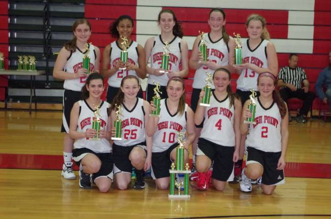 The eighth grade High Point Wildcats pose with their trophies.