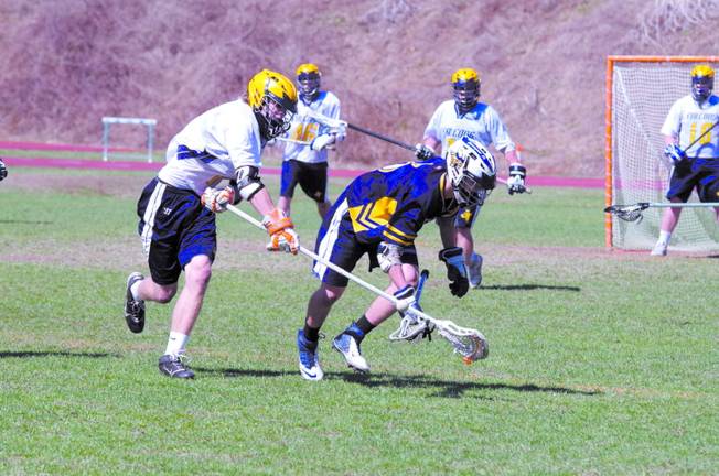 Photo by George Leroy Hunter A Jefferson Falcon knocks the ball loose from a Vernon Viking.