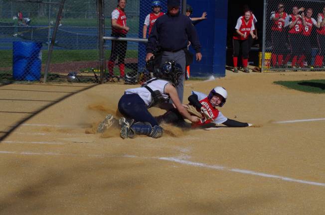 Pope John's catcher Kaitlyn Morrison tags out High Point's Brooke Grau.