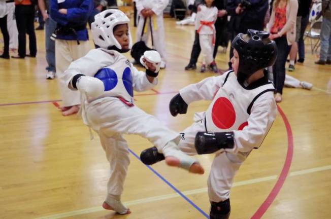 Two little martial artists go toe to toe in the sparring competition.