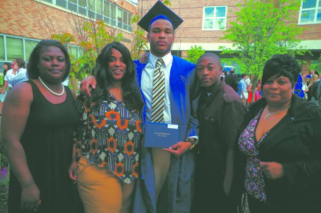 Pope John XXIII Regional High School graduate Treyvaughn Jahquise Davis with his family.