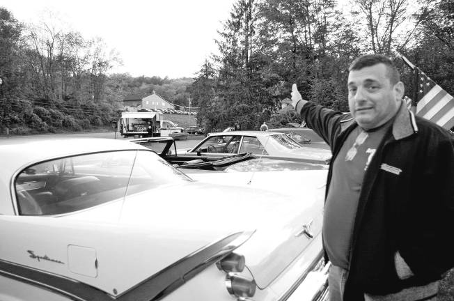 Classic cars cruise into Branchville Victoria Diner owner Michael Hatzimihalis talking about the cars. Hatzimihalis is also a Rockaway Township police officer.