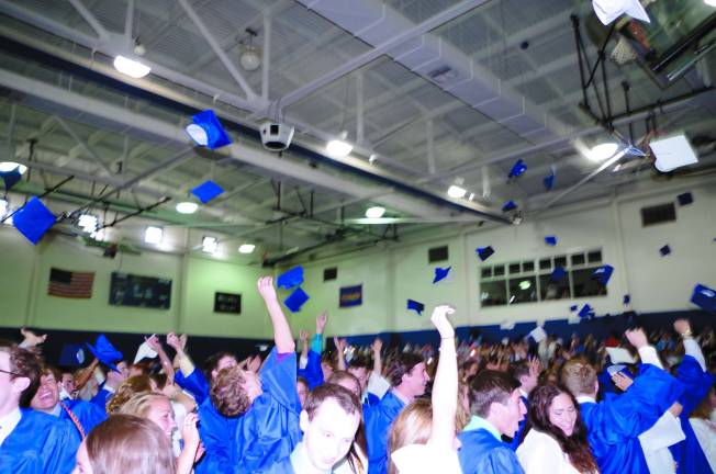 Pope John XXIII Graduation Pope John XXIII Regional High School graduates do the traditional hat toss at the conclusion of the graduation ceremony.