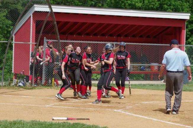 The High Point Regional Wildcats celebrate as Ally Frei arrives at home plate scoring the game's lone point.