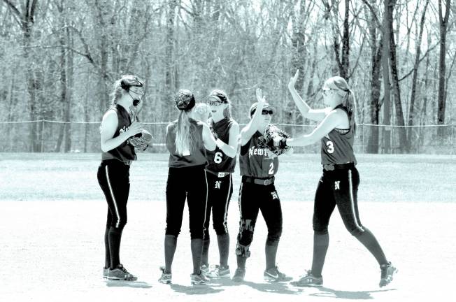 Newton Braves on the pitchers mound.