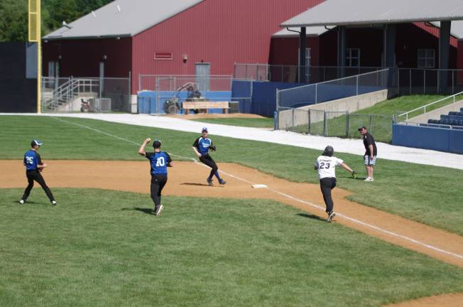 Kittatinny fields the ball as Wallkill's Jake Deanda heads to first base.