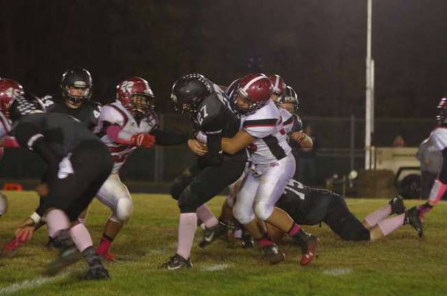 Wallkill Valley's running back Dylan Harlos (27) tries to advance the ball.