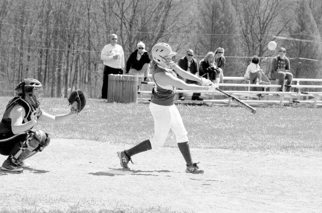 Sussex Tech's Katie Jakubowski connects with the ball in a girl's varsity softball game against Newton, Monday, April 21, 2014, in Sparta.