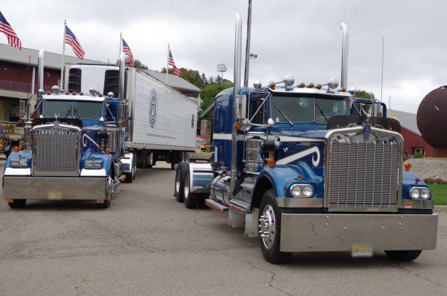A pair of Kenworth trucks parked at the front entrance of Skylands Stadium. The 27th Annual American Truck Historical Society Truck Show (Metro Jersey Chapter) took place at Skylands Stadium in Augusta, New Jersey on Sunday, October 15, 2017.