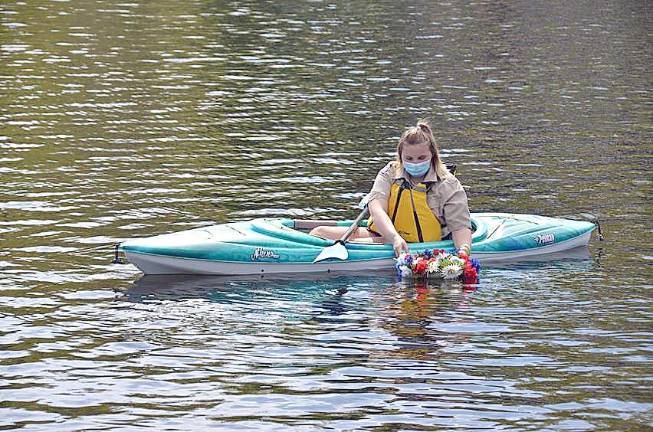 Byram honors those who made the ultimate sacrifice Alexandra of Troop 1151 Byram lays wreath on Cranberry Lake in memory of first responders and service members the community has lost. (Photo provided)
