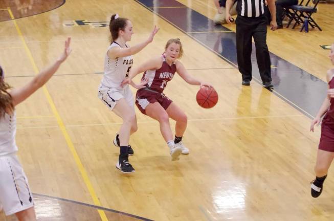 Newton's Olivia Buckley dribbles the ball while covered by Jefferson's Patricia Orlandoni in the second half. Buckley scored 8 points.