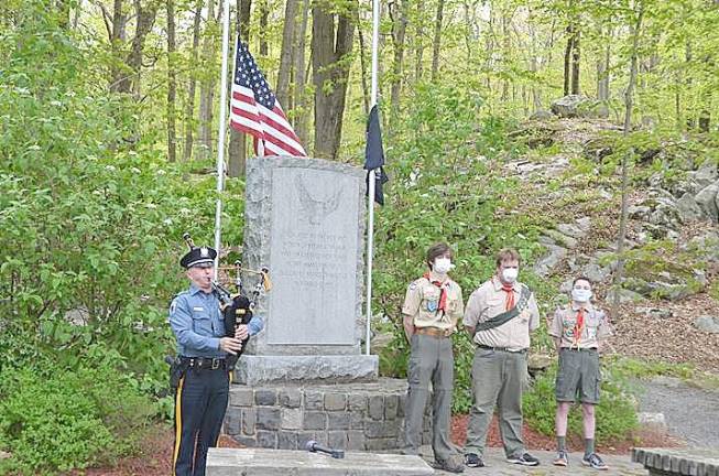 Byram honors those who made the ultimate sacrifice Byram Ptl. Todd Sodano, Sgt. Tom Dellicker and Chief Kenneth Burke salute as the flag is raised. (Photo provided)