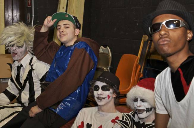 These fashionistas know how to sew Backstage models and designers pose for a shot before the fashion show. From left, Frank Rocco as Beetlejuice; Niko Soto wears a fabric and duct tape hoodie; Chris Acker dressed as a card; Devon Slockbower as jack Skellington from The Nightmare Before Christmas; Ivan Ballew between costume changes.