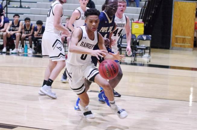 Wallkill Valley's Ivan Hicks reaches for the loose ball in the second half. Hicks grabbed 5 rebounds, made 3 assists and scored 8 points.