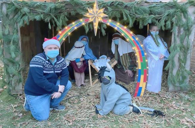 Nativity players gather at the manger (Photo courtesy of Father Julio)