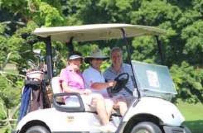 A happy threesome at the 22nd K.E.E.P. golf outing.