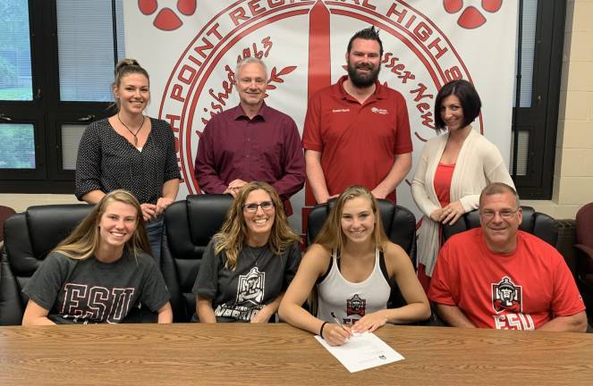 High Point's Haley Britt, seated second from right, signs her National Letter of Intent to continue her swimming career at East Stroudsburg University. Pictured seated left to right: sister Kassie, mother Jen, Haley, and father James. Standing left to right: Head Coach Kate Niemiera, Club Coach George Soutter, Club Coach Kevin Carney, and Assistant Coach Jaclyn Bambera.