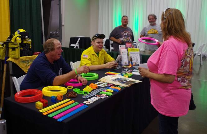 Andover Station New Jersey Forest Fire Service firefighters Jeff Meyer of Hampton and Frank Chiofalo of Hardyston were on hand to show visitors their gear and give away a wide assortment of gifts from rulers to pencils to Frisbees.