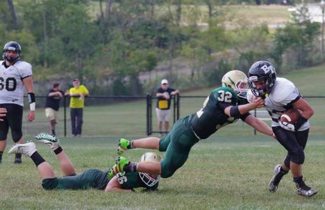 Sussex Tech linebacker Kevin Utter grabs the jersey of Bergen Tech running back Tyler Pavese.