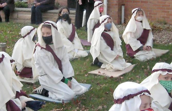 Our Lady of Fatima parishioners tell the story of Christmas Shepherds receive their instructions (Photo by Janet Redyke)