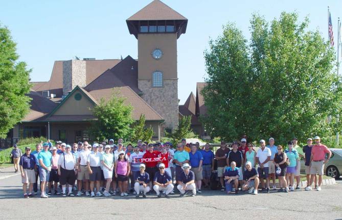 The 24 competing scramble team line up for a photo prior to the start of play in the Brews &amp; Birdies Golf Tournament