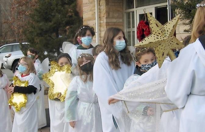 Our Lady of Fatima parishioners tell the story of Christmas Angels prepare for Las Posados (Photo by Janet Redyke)