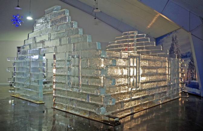Ice sculptures coming to Skylands Stadium A sculpted log cabin is incredibly detailed to include wood-like grains in the surfaces of the blocks.