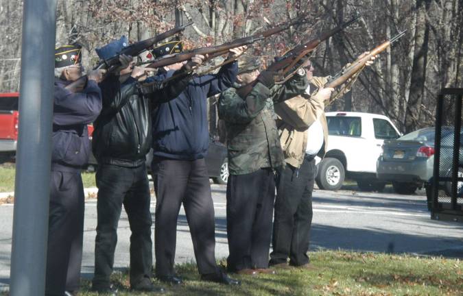 Members of American Legion Posts 245 and 423 form a firing squad to salute the Veterans and residents of Jefferson Township who are serving in the Armed Forces.
