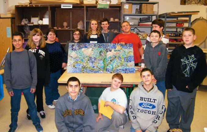 High Point art students create stained-glass murals Photos by Viktoria-Leigh Wagner Visual-Fine Arts teacher Kelly Kuzicki, center, surrounded by her class of Exploratory MCI Art students presenting their first completed mural, 'A Field of Peace Poppies,' which will be hung in the English Dept. at High Point Regional High School.