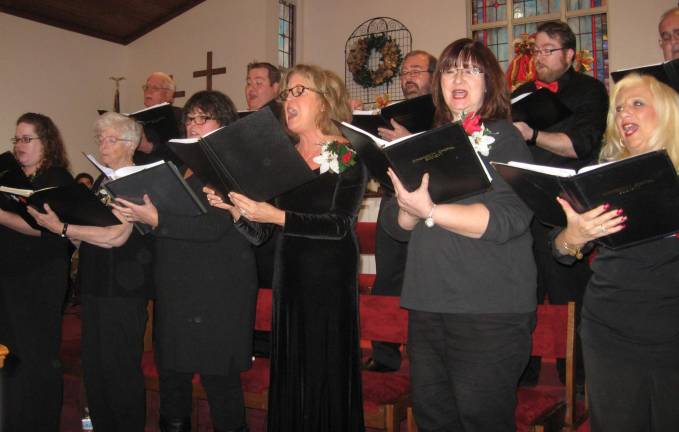 The Community Choral Society gets the audience in the holiday mood.