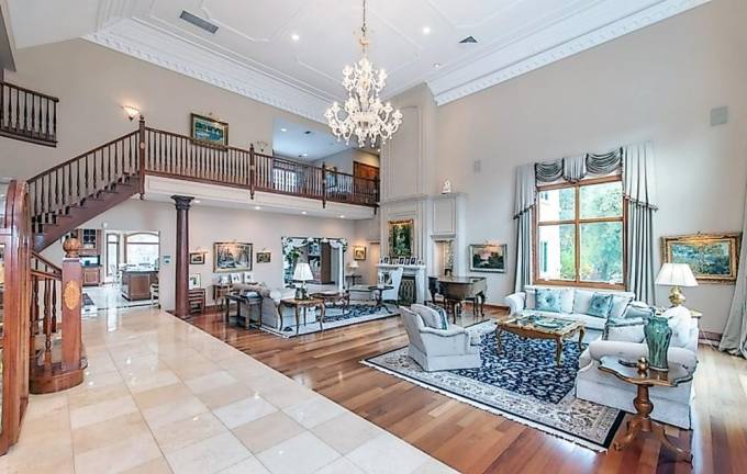 Custom estate includes car charging station, hot yoga room, and frescos