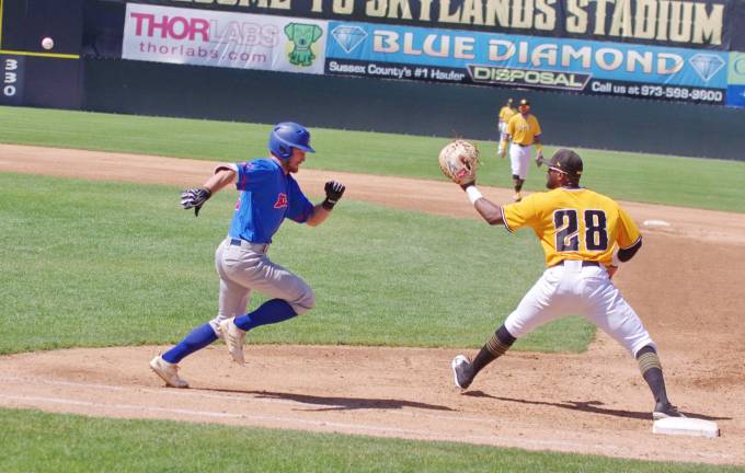 Rockland Boulders runner Mitch Piatnik tries to beat the ball to first base in the third inning. The ball made it into the glove of Sussex County Miners first baseman Audy Ciriaco (28) before Piatrik's arrival resulting in an out.