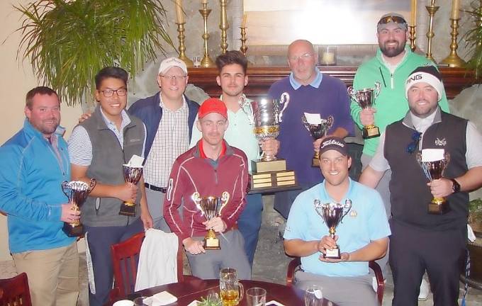 The Wild Turkey Golf Team with hold their trophies as the 2019 Employee Cup Champions.