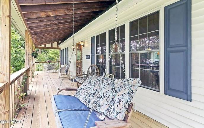 Four-bedroom lakefront cape has private dock