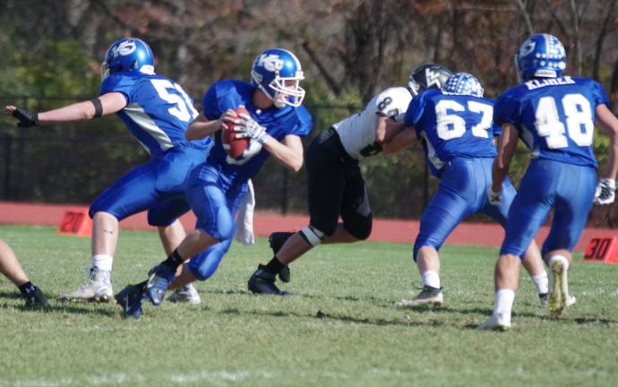 Kittatinny's quarterback Nicholas Geimer with the ball during a roll out play.