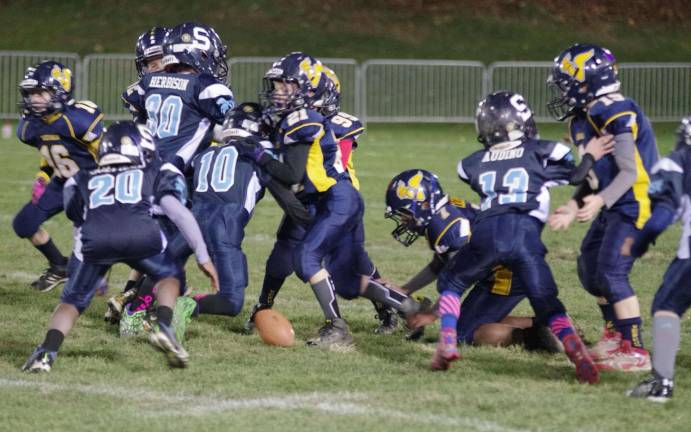 Milk Bowl makes a difference All-day youth football event brings community together A loose ball on the field during the Sparta Pony versus Vernon Pony game.