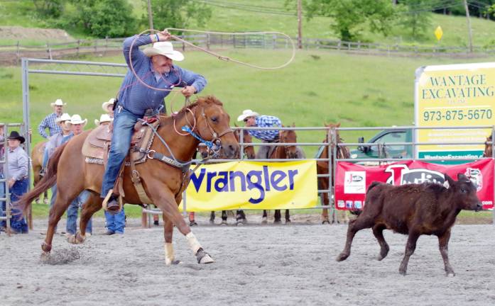 On the move in the tie-down roping event.