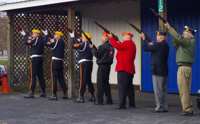 Shots were fired at the end of the ceremonies followed by two bugle players playing &quot;Taps.&quot;