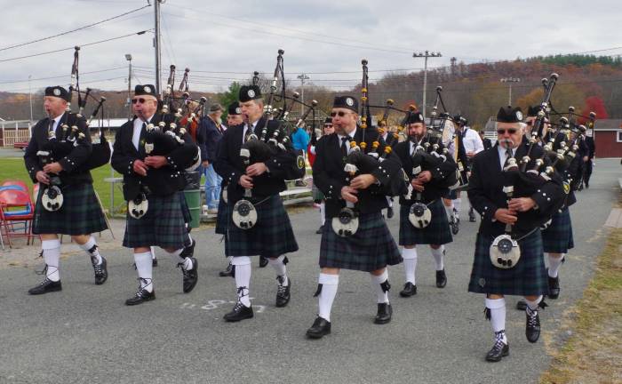 Bagpipers are shown in the parade.