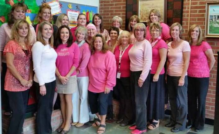 Some of the Hamburg School staff wearing pink, and pink hair extensions by Headz Up Salon in Hamburg in support of Breast Cancer Awareness and their co-worker.