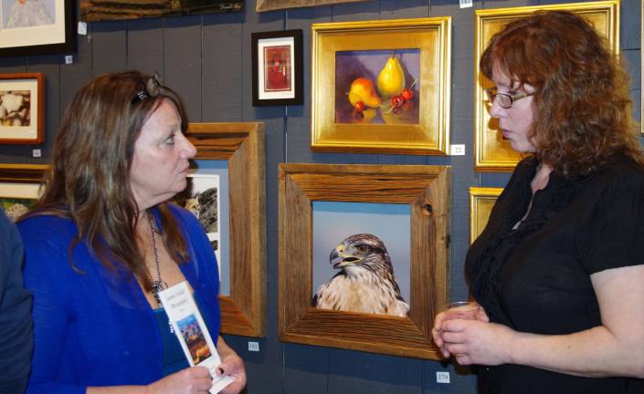 Sparta artist Patty Margalotti, and artist Brenda Decker of Stockholm talk about their artwork at Art Etc in Hamburg.