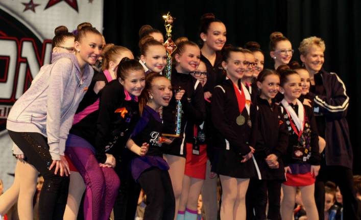 Performers in &quot;Hands in Da Air&quot; receiving XCALIBER Trophy.