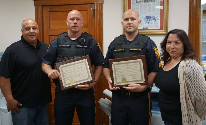 Ogdensburg Mayor Steve Ciasullo, left, honors Patrolman Christopher Geene and Sergeant Stephen Gordon, along with Councilwoman Regina Rizzo on June 8.