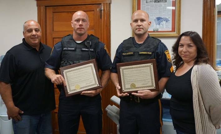 Ogdensburg officers honored for saving woman's life Ogdensburg Mayor Steve Ciasullo, left, honors Patrolman Christopher Geene and Sergeant Stephen Gordon, along with Councilwoman Regina Rizzo on June 8.