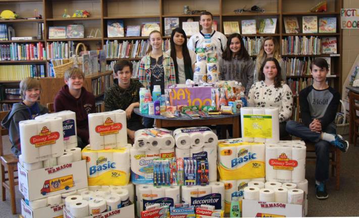 Students are shown with some of the items to be donated