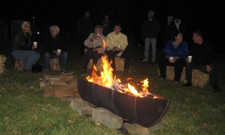 Visitors enjoyed the warming fire, cider and cookies.