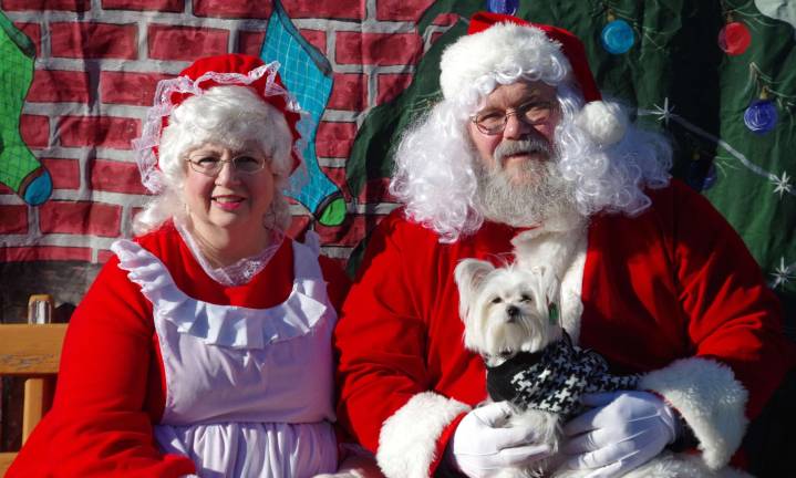 Khloe poses with Santa and Mrs. Paws at the Vernon Dog Park on Saturday. The friendly little pup belongs to Dena Schlossareck of Vernon.