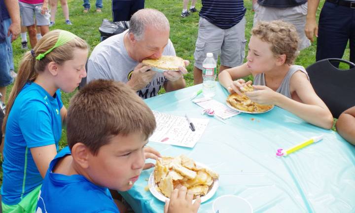 The pie-eating contest was fun. Nearly all the participants were children, except for Police Director Wayne Yahm, who had some too.