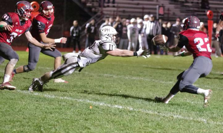 Pascack Hills receiver Jack Eichner and High Point defensive back Gavin Hunsicker try to catch the ball in the second half. Hunsicker intercepted the ball.